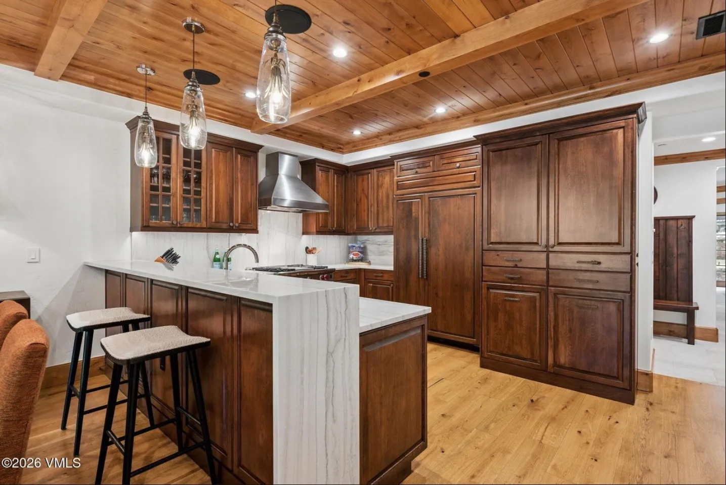 Renovated kitchen with quartzite waterfall island